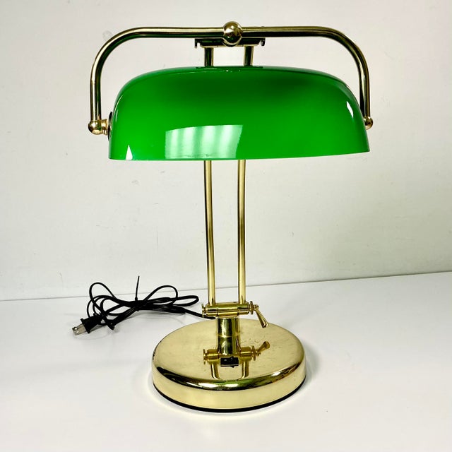 Offering a classic Art Deco Bankers Desk Lamp from the 1970s. It features an iconic Emeraldite Bottle Green Glass shade...