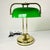Offering a classic Art Deco Bankers Desk Lamp from the 1970s. It features an iconic Emeraldite Bottle Green Glass shade...