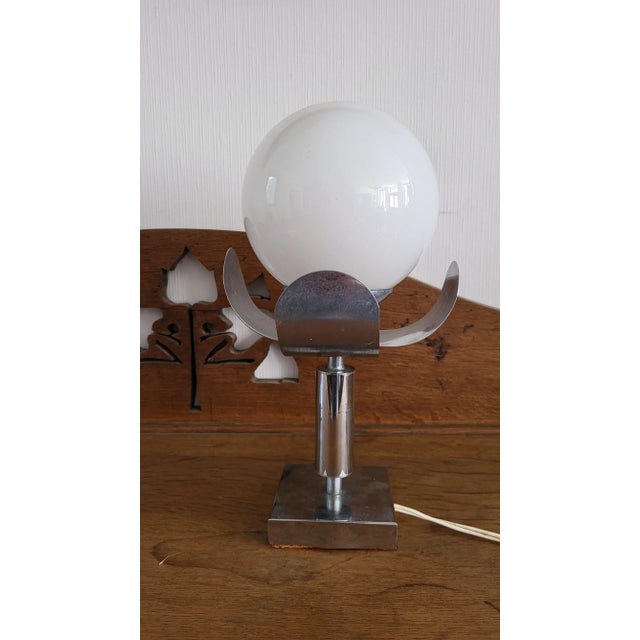 Pair of 70s lamps in chrome metal / white opaline globe. Height 30 cm. Width / depth 16 cm. In good condition. No notable...