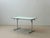 This original kelko folding table impresses with its ingenious folding mechanism and clean, functional design. With just a...