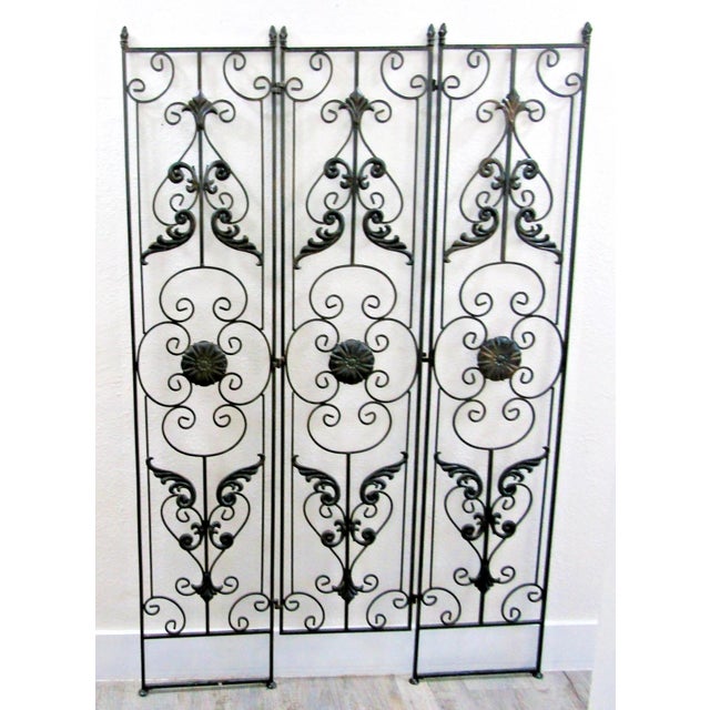 The Vintage Regency Black Wrought Iron 3 Panel Room Divider is a stylish and functional piece of furniture for any room....