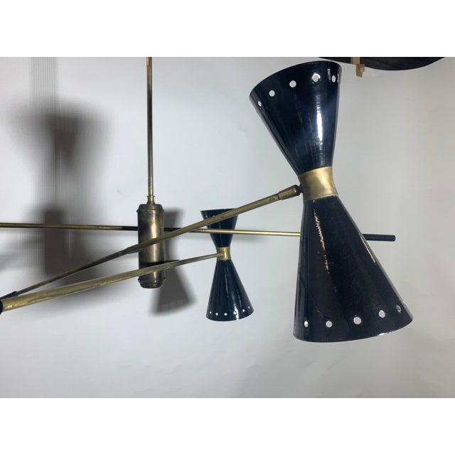 The chandelier has various joints, the rods can be oriented, the cones can be rotated European Plug (up to 250V).The...