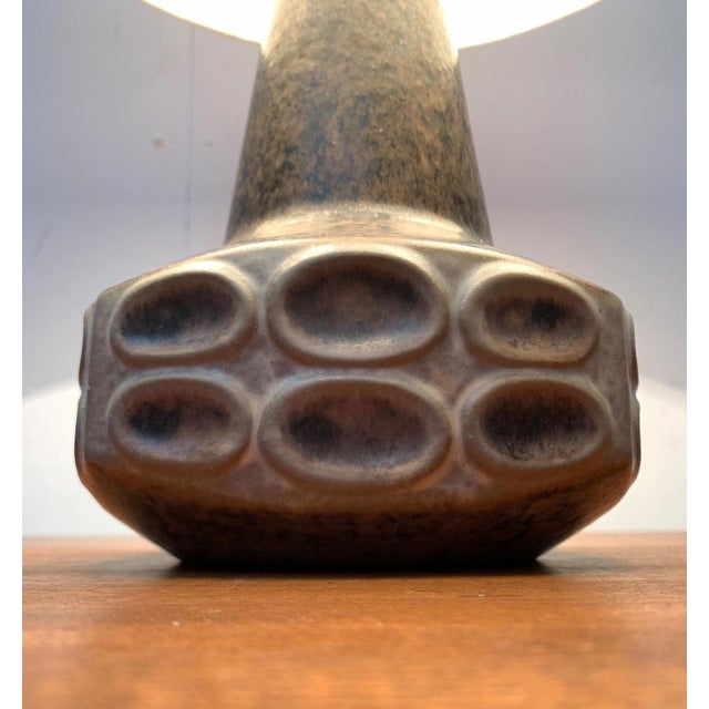 Ceramic table lamp from the Danish manufacturer Michael Andersen after a design by Marianne Stark from the 1960s. The slim...