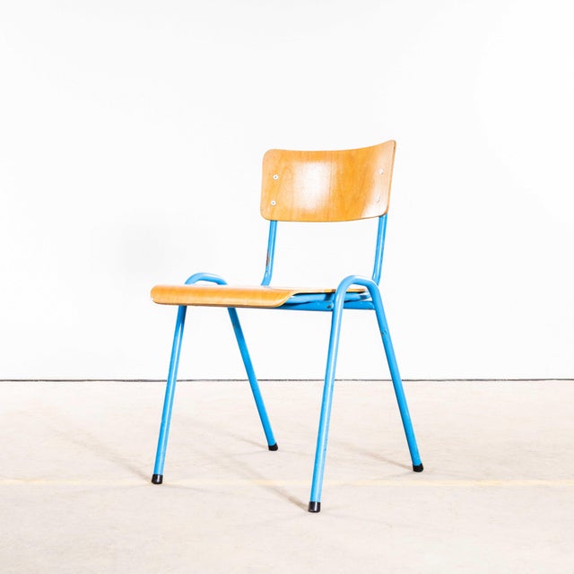 1960’s Elbe Blue Stacking Dining Chairs - Set Of Four These are vintage stacking school or university dining chairs, made...