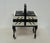 Chippendale-style wooden sewing box on casters, accordion-style drawers, 3 shelves in black and white, refinished with...