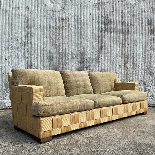 This Vintage Coastal Donghia “Block Island” Woven Rattan Sofa embodies relaxed sophistication with its seamless blend of...