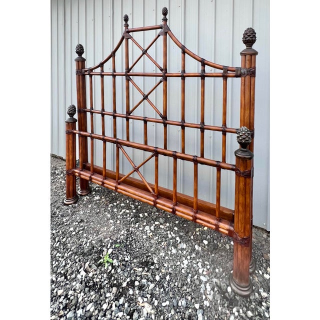 Wonderful queen size pagoda style bed. Hollywood regency glamour with cast metal pineapple finials atop the four posts and...