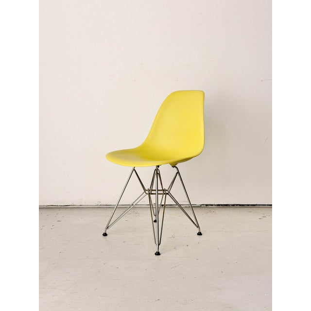 Set of 6 authentic Herman Miller Eames DSR side chairs in lemon yellow with chrome Eiffel bases. Embossed Eames Office /...