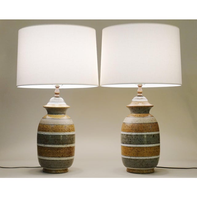 A pair of profound and brilliant large Ginger Jar shaped Mid Modern Art pottery sculpture clay table lamps circa 1960's....