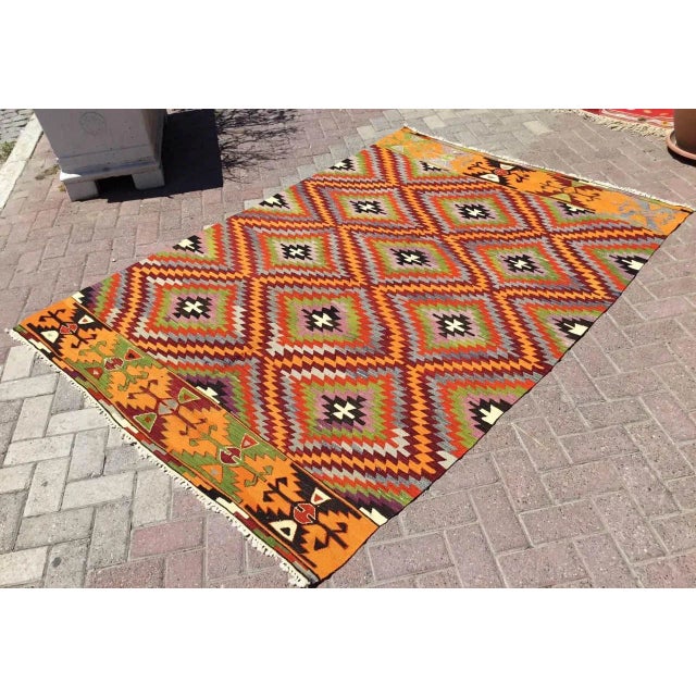 This beautiful, vintage, handwoven kilim is approximately 60 years old. It is handmade, of very fine quality hand spun...