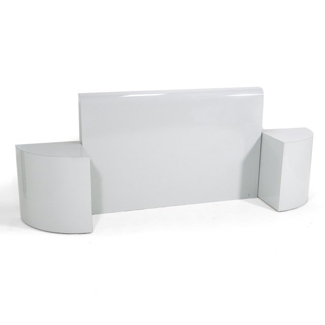 Strikingly spare, almost minimalist with a touch of post-modern, this terrific queen size headboard and matching...
