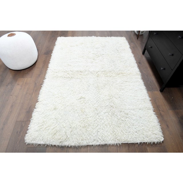 Vintage Hand-Knotted beige area rug is a semi-antique vintage area rug. The '70s Eastern region of Anatolia's unique rug...