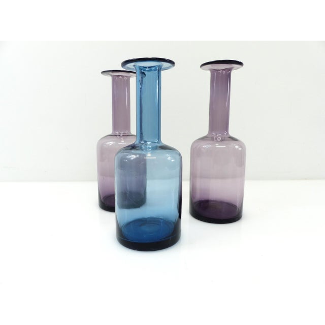 A set of three blown glass vases from the Gulvvase series, designed by Otto Brauer for Holmegaard in Denmark in the 1960s....