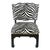 A pair of Asian style chairs in black and white zebra styled after James Mont