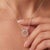 Delicately crafted in 925 Sterling Silver, this ethereal pendant necklace features a graceful open circle design adorned...