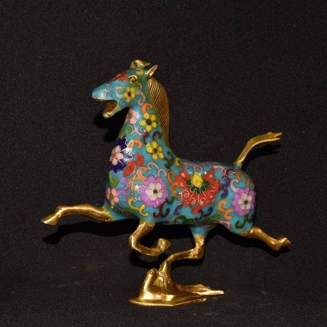 This is a finely crafted antique cloisonné enamel sculpture of a galloping horse, a traditional symbol of power,...