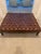 Chocolate brown ottoman coffee table; real leather with sophisticated tufting. It is a large rectangular oversized ottoman...