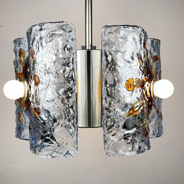 Mid-century ice murano glass chandelier mazzega by toni zuccheri was made in italy in the 1970s. Although the lamp is not...