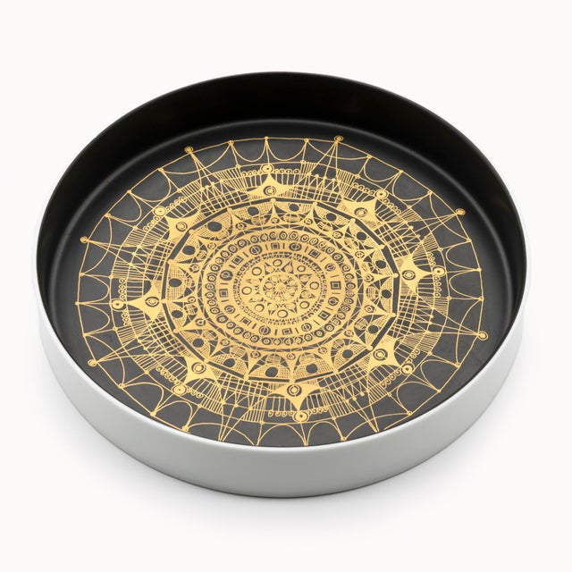 A low porcelain bowl designed by Hans Theo Baumann for Rosenthal Studio-Line in the 1970s. The white exterior gives way to...