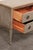 A French smaller-sized, painted wood, raised chest of two drawers from the 19th century. This antique commode from France,...