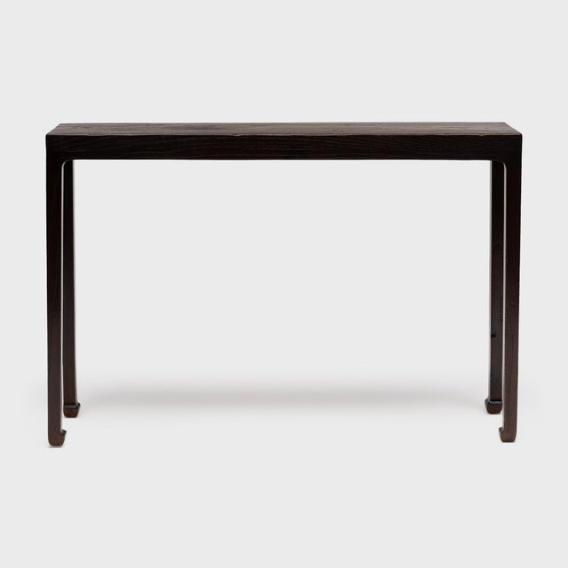 With clean lines and balanced proportions, this narrow console table recalls the austerity of Ming-dynasty furniture...