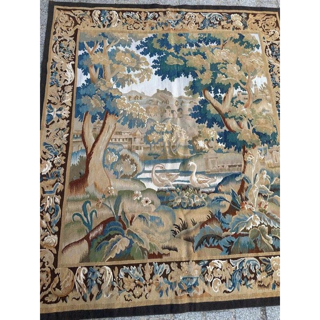 A finely handwoven tapestry dating from the early 21st century, executed in china, in wool and silk on a high-warp (haute-...