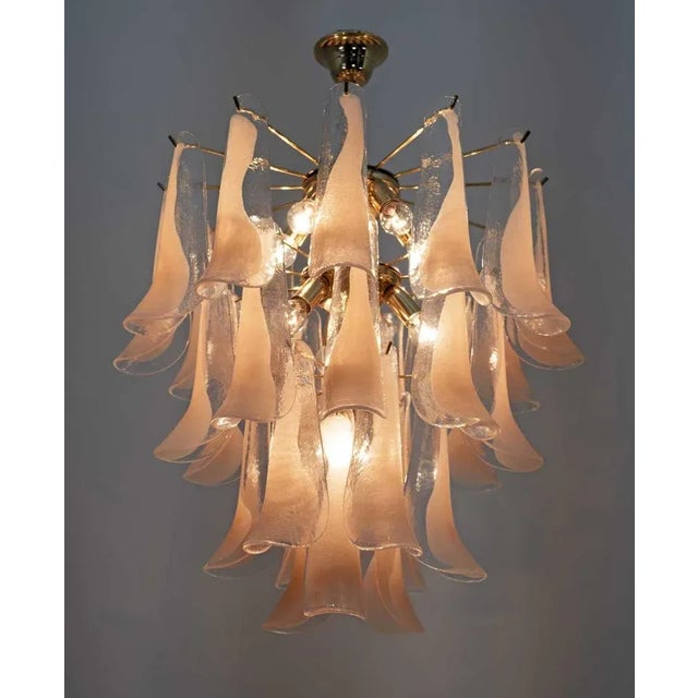 Murano Chandelier produced by Mazzega, consisting of 30 petals in pink and transparent glass supported by a golden brass...