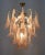 Murano Chandelier produced by Mazzega, consisting of 30 petals in pink and transparent glass supported by a golden brass...