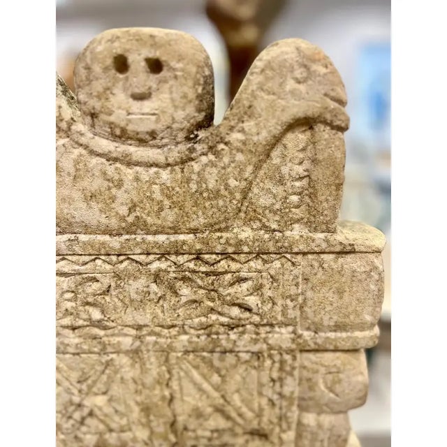 Handcarved Stone Sculpture on a Metal Stand.