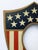 Early 1900s wood painted patriotic picture frame shield with holes on back side to hold five flags. Oval opening for...
