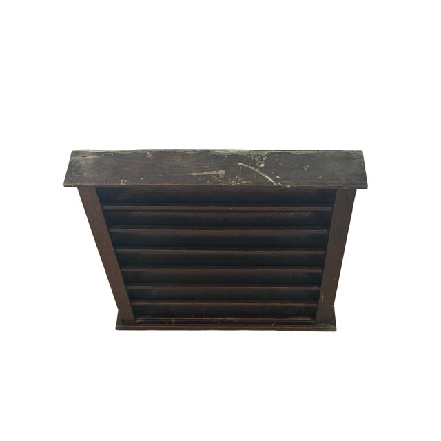 A handsome antique wooden billiard ball display rack featuring six narrow horizontal display tiers, traditional plank...