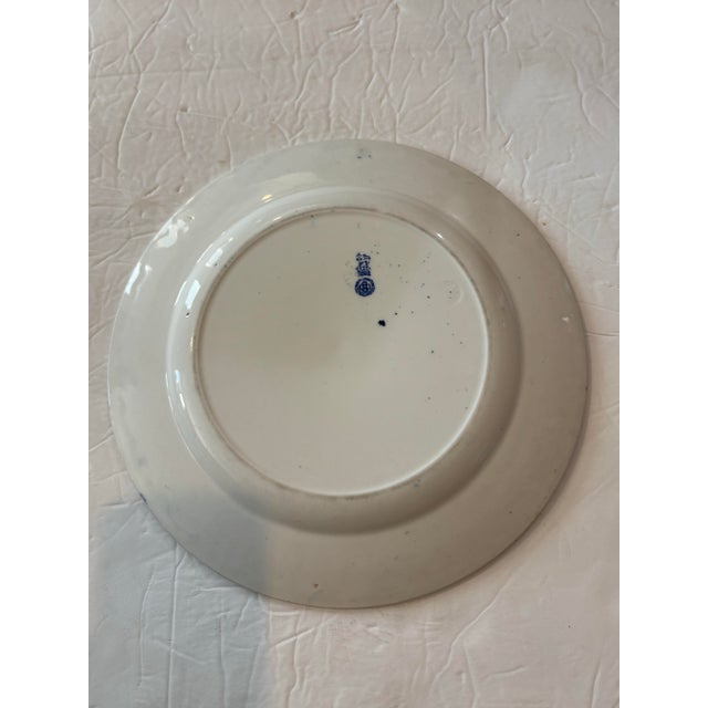 "Gibson Girl" plate made by Royal Doulton, circa 1902-15. The series of 24 depicts the trials and tribulations of an...