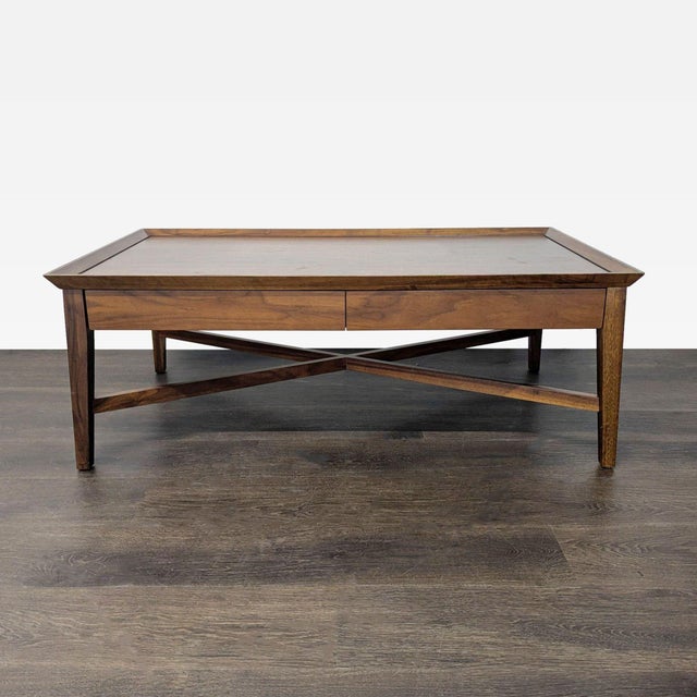 Two drawer X braced walnut coffee table Brand Crate & Barrel Dimensions 48.3ʺW x 26.3ʺD x 17.8ʺH Item ID 1069495 # Pieces...