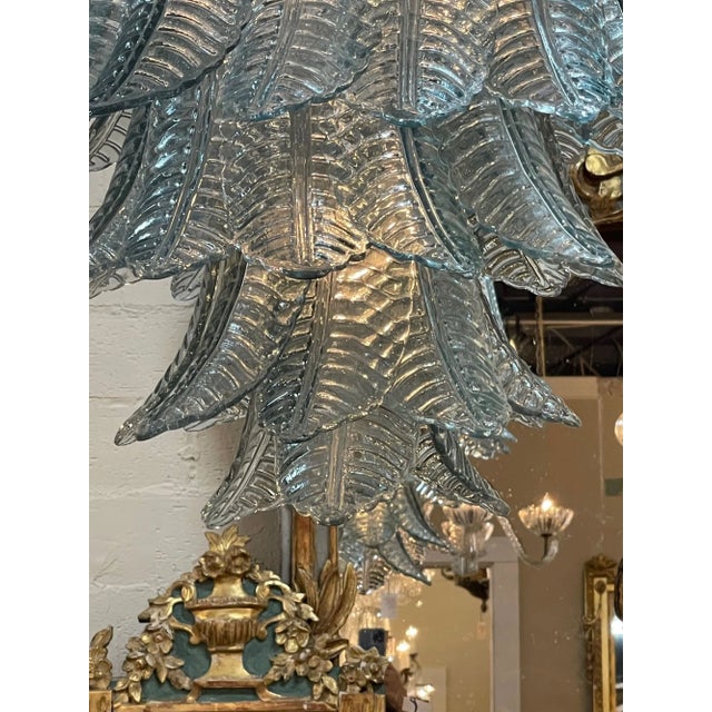 Fabulous modern aqua blue Murano glass waterfall chandelier. Featuring beautiful glistening glass in the shape of palm...