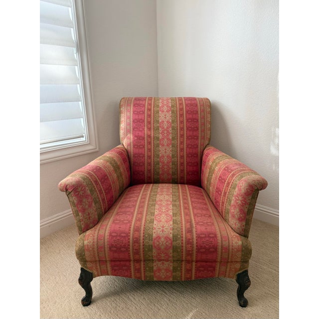 Add warmth and character to any room with this beautiful vintage traditional upholstered accent chair. Featuring a classic...