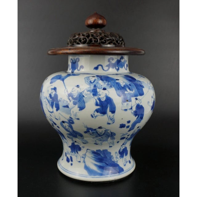 A very fine antique Chinese blue and white porcelain vase, dating to the Qing Dynasty, specifically the Kangxi period...