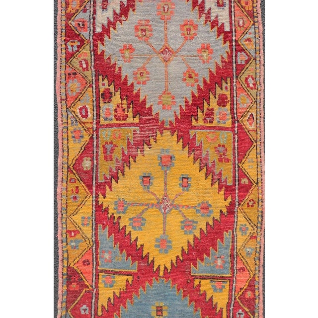 Measures: 3'2 x 10'0 Vintage Turkish Oushak Runner with Bold Gold, Red, and Sky Blue Medallions. Keivan Woven Arts / Rug...