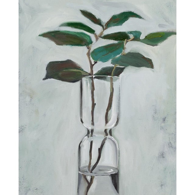 About the painting: this artwork portrays a minimalist yet striking still life, featuring a clear glass vase containing a...