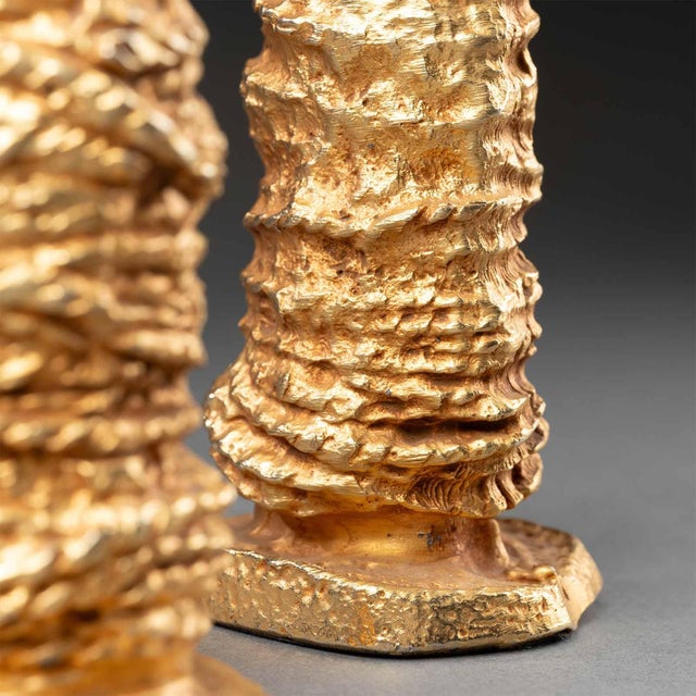 This remarkable pair of gilded cast aluminum candlesticks is a creation by Pierre Casenove for Fondica, produced in the...