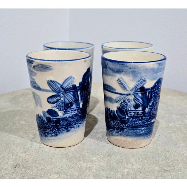 Vintage Delft‑style blue and white windmill tumblers in a charming set of four, marked Made in Japan, featuring classic...