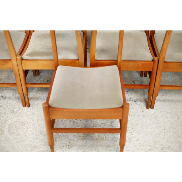 Set of 5 chairs in wood with tapered legs, circa 1975. Synthetic leather seat (rather delicate, some traces and small...