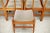 Set of 5 chairs in wood with tapered legs, circa 1975. Synthetic leather seat (rather delicate, some traces and small...