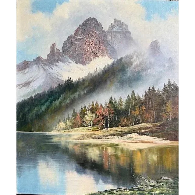 A 1930s mountain lake landscape oil painting by Joachim Lemke — unframed. Measures 19.75"W x 23.75"H. A serene alpine lake...