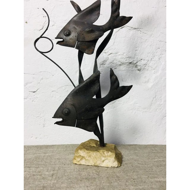 Mid-century iron sculpture of fish, with solid stone base. Perfect condition.