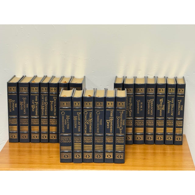 Design Plus Gallery presents a collection of Patrick O’Brian Aubrey Maturin Leather Bound Books, Twenty Volumes. The set...