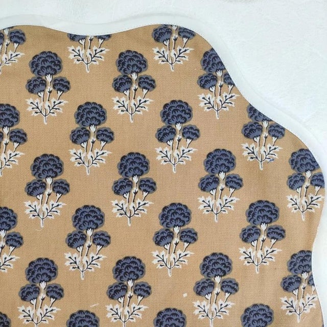 A beautiful set of round scalloped placemats in a pretty beige & navy blue floral print with a classic white piped edge....