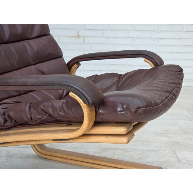 1970s, Danish armchair by Georg Thams. Original brown furniture leather, bent beech wood, canvas. Original good condition:...