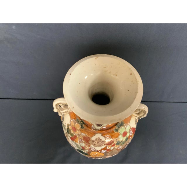 Dated from 1910. Japanese style satsuma vase. Made of ceramic. Raised gilt detailing over colorful imaging. A great...