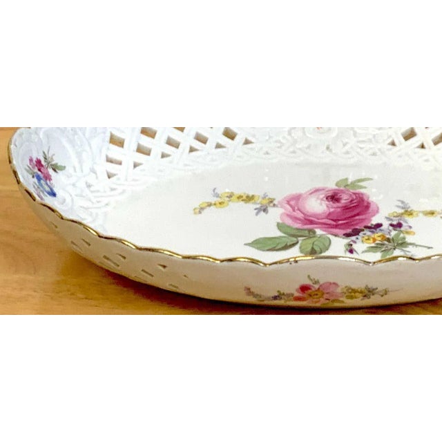 19th century Meissen floral painted reticulated oval basket, with gilt rim, pierced surround, hand painted with center...