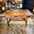 This is a wonderful side or writing table in solid walnut that perfectly adheres to the Baroque aesthetic. The table has...